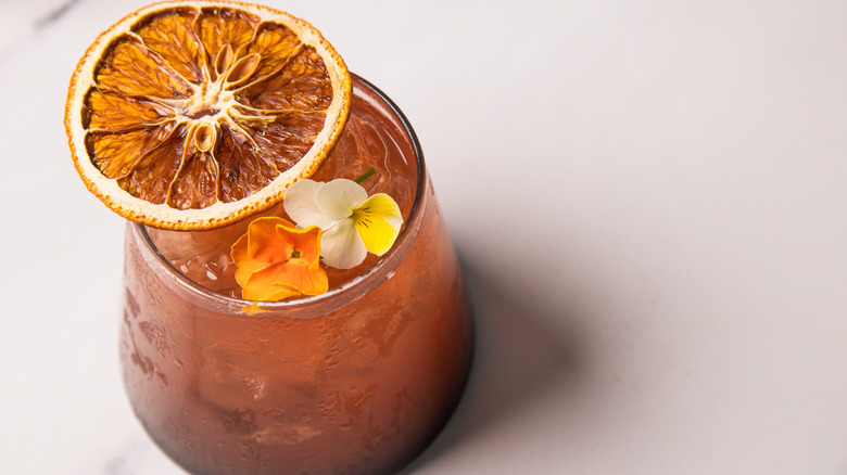 A blood orange rum sunset cocktail in close up