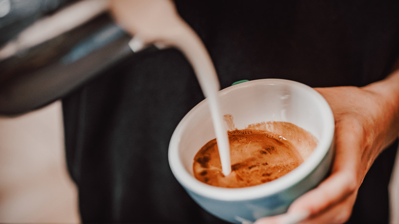 cream poured into coffee cup