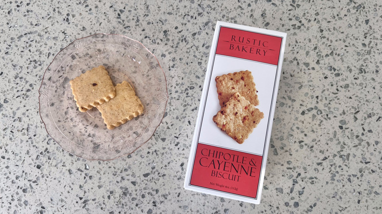 Chipotle & Cayenne Biscuits on a plate with its packaging