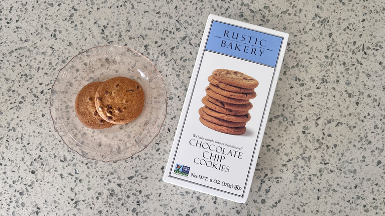 Two Chocolate Chip Cookies on a plate with its packaging