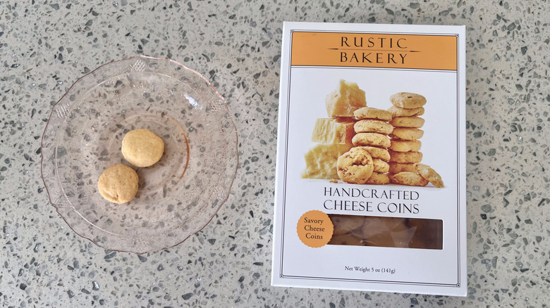 Savory Cheese Coins on a plate with its packaging
