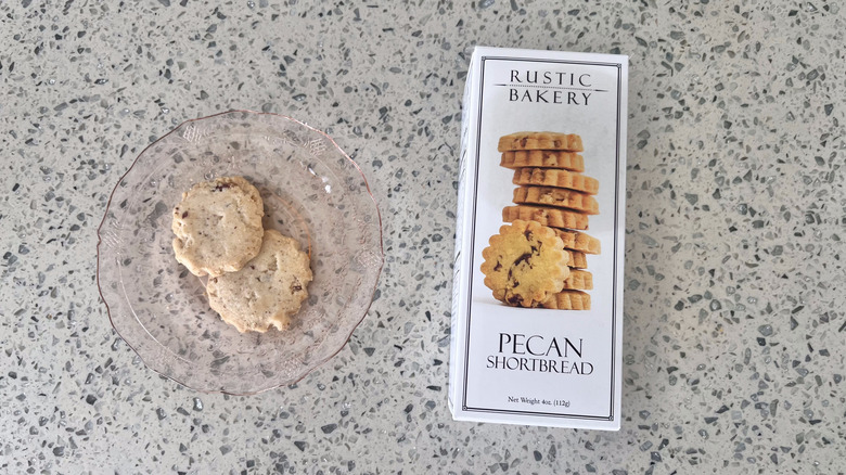 Two Pecan Shortbread on a plate with packaging