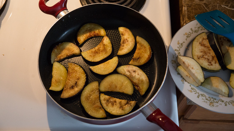 fried eggplant slices in pan