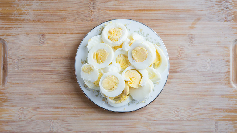 sliced boiled eggs on plate 