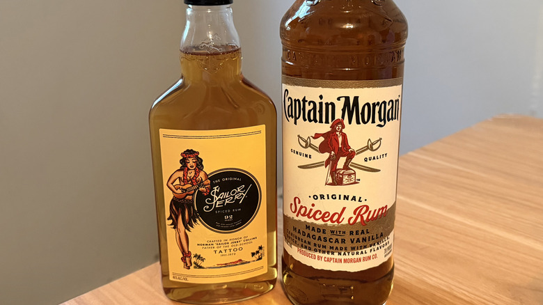 Close-up of a Sailor Jerry bottle next to a Captain Morgan bottle