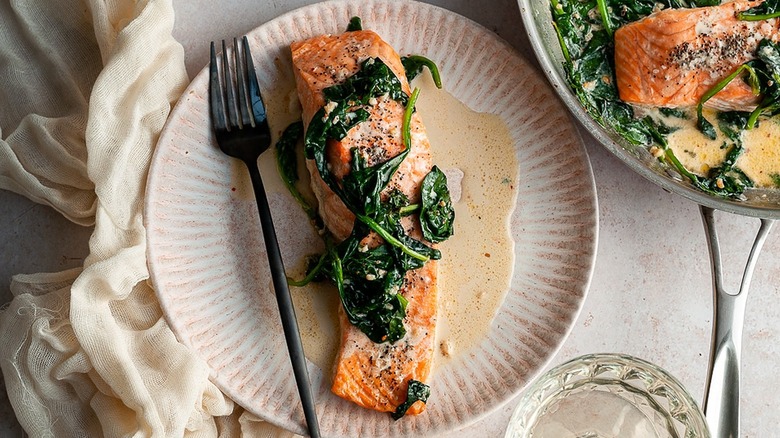 salmon with spinach on plate