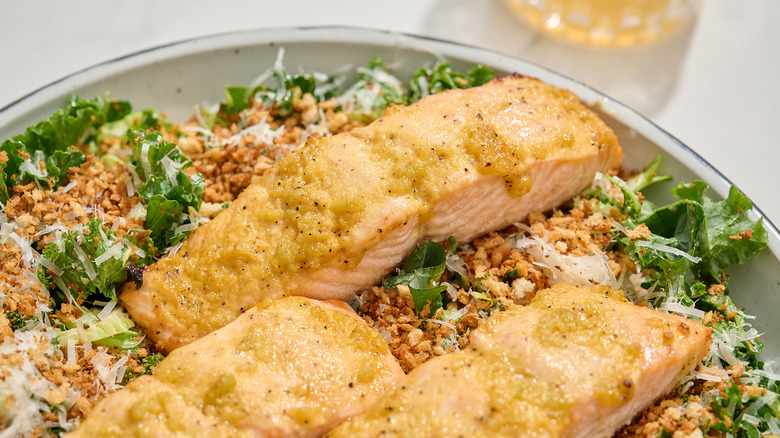 close up of salmon on a salad