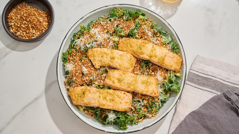 caesar salad topped with filets of salmon
