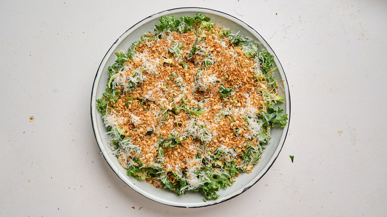 salad topped with parmesan and breadcrumbs