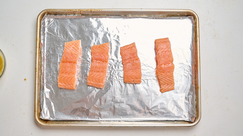 salmon arranged on a sheet tray
