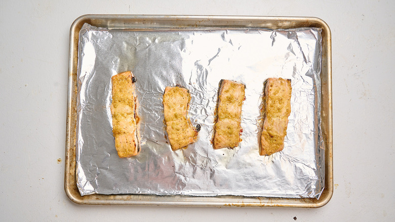baked salmon on a sheet tray