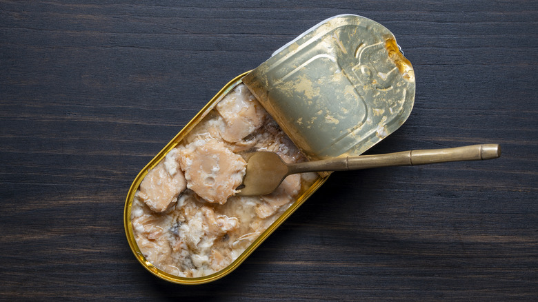 Open can of salmon.