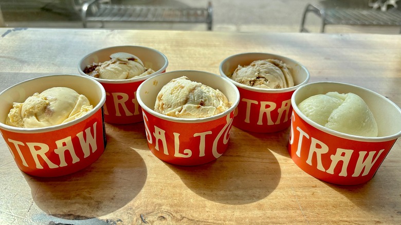Five cups of Salt & Straw's Apple Series on wooden table