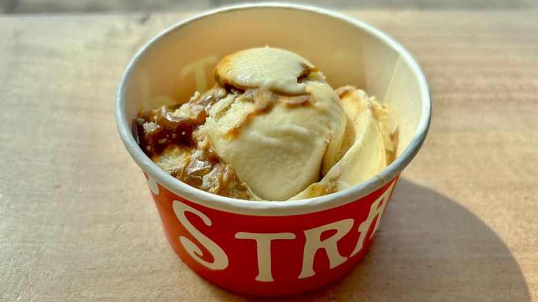 Cup of Salt & Straw Caramel Apple Sherbet on wooden surface