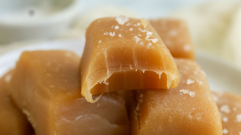 Close up of caramel candy with bite taken
