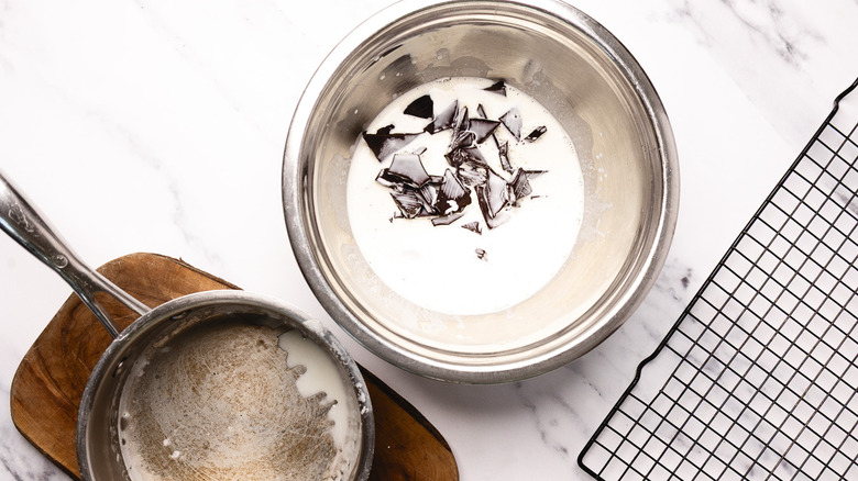 Melting chocolate in warm cream.