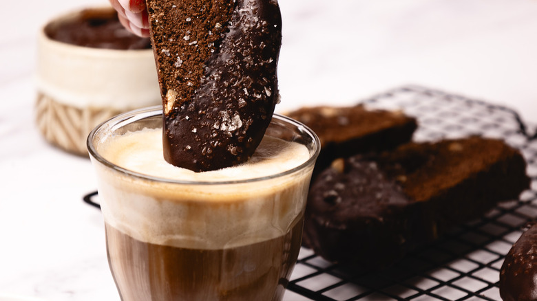 Dipping biscotti into coffee.