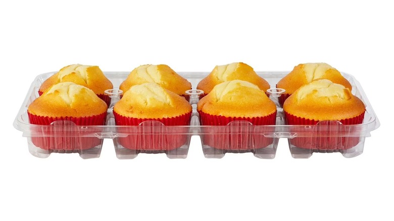 A container of six muffins in red wrapping from Sam's Club on white background