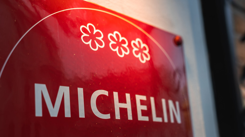 A close up shot of the Michelin three-star sign