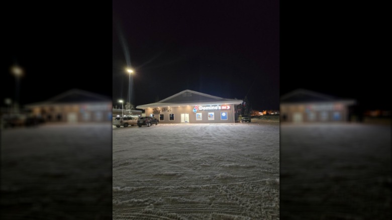 Domino's location in North Pole with snow in the parking lot