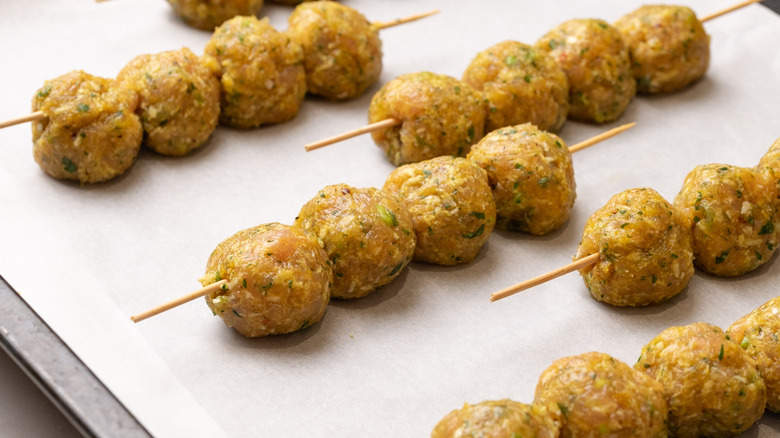 skewered meatballs ready for broiling