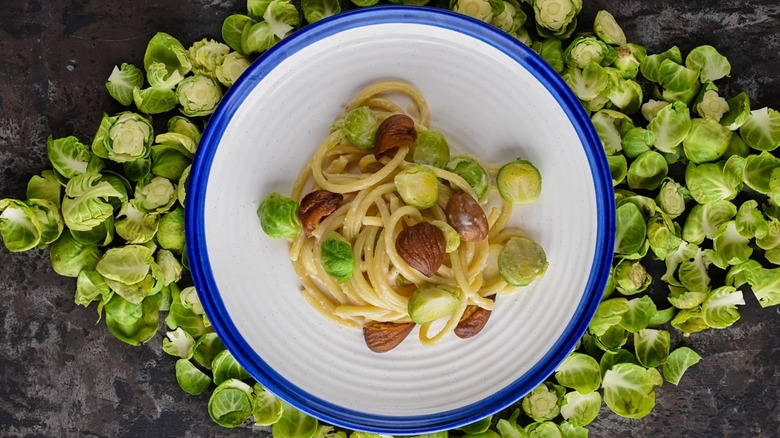 Bowl of spaghetti with Brussels sprouts and chestnuts
