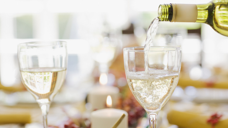 White wine poured into glasses