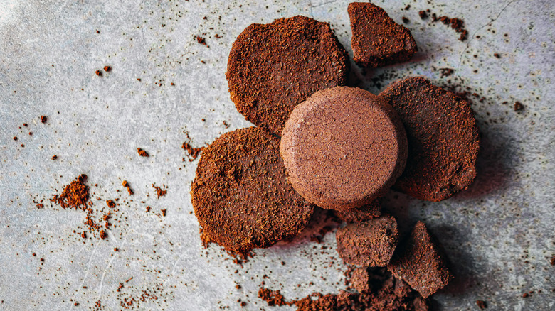 An aerial view of a pile of spent espresso coffee ground pucks