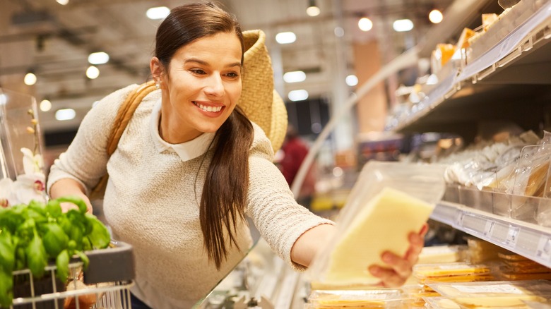 a woman buying cheese