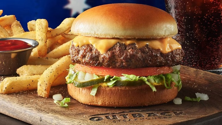 Outback Steakhouse' cheeseburger, fries, and ketchup