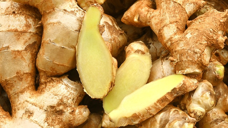 Fresh ginger root whole and halved