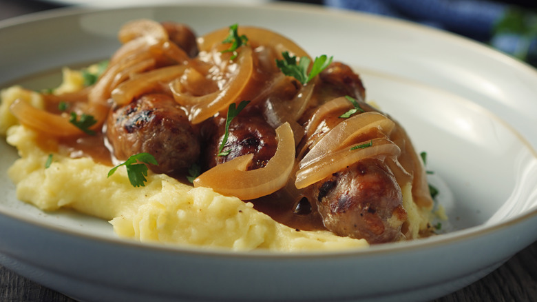 German Himmel und Erde on a plate with onions and pork