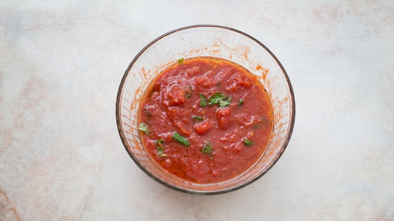 canned tomatoes in mixing bowl