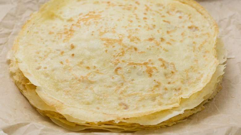 stacked crepes on baking sheet