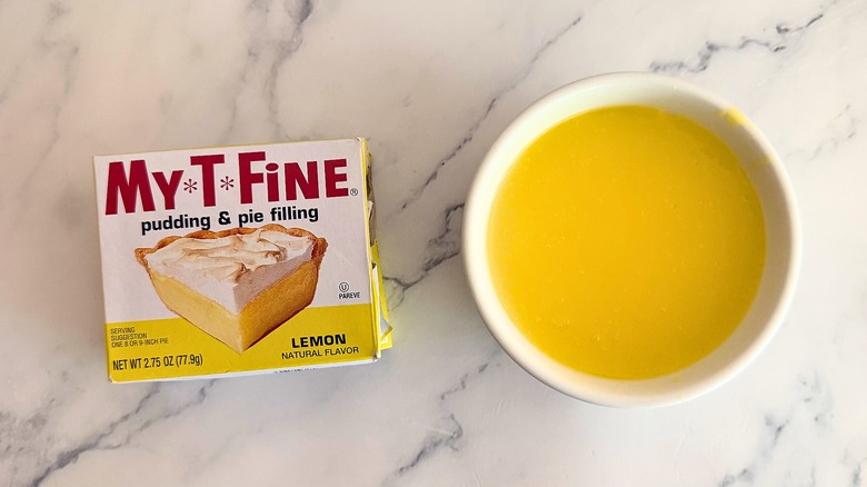 Pie filling and bowl of lemon filling on a countertop