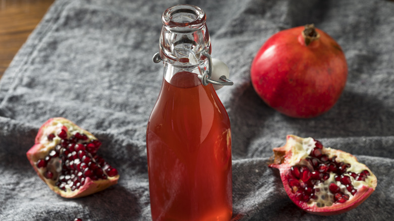 grenadine in a half karafe with pomegranate seeds