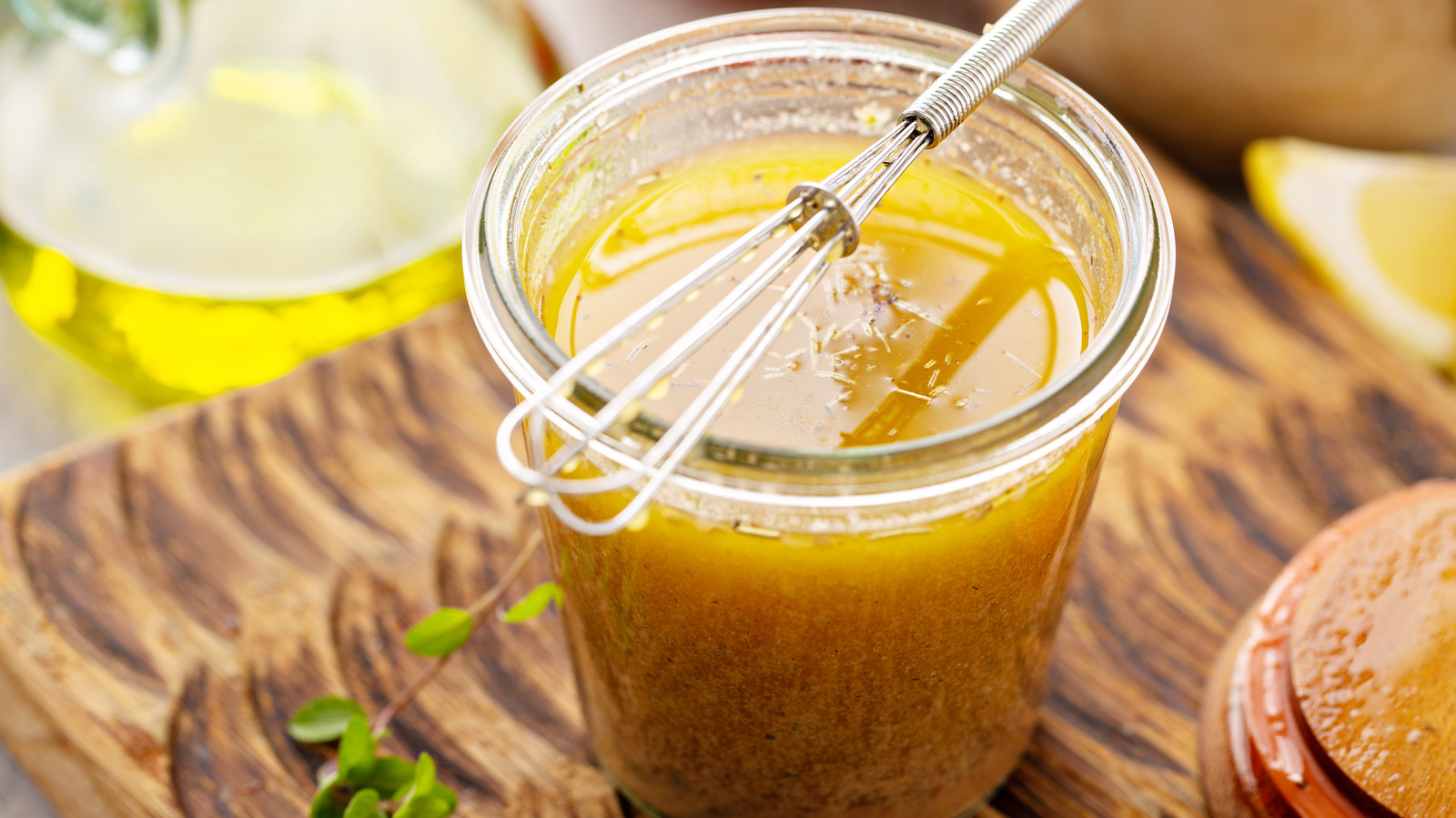 Say Goodbye To Boring Salad Dressings: Upgrade Them With This Ingredient From Your Bar Cart