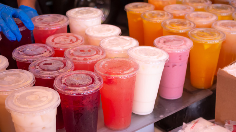 A variety of traditional Mexican agua frescas is served in cups.