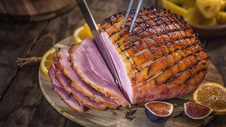 A holiday ham being sliced
