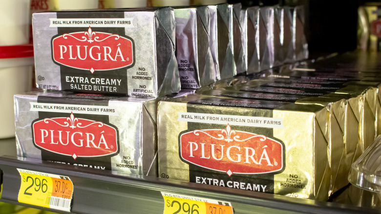 Packs of Plugra Butter on store shelf