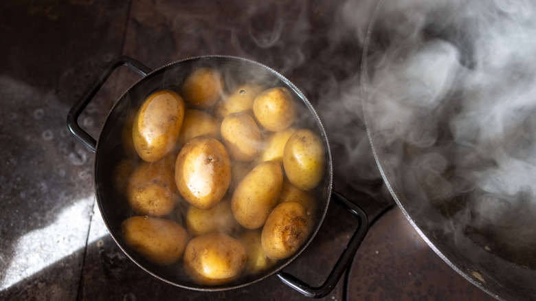 aerial shot of potatoes boiling in a pot