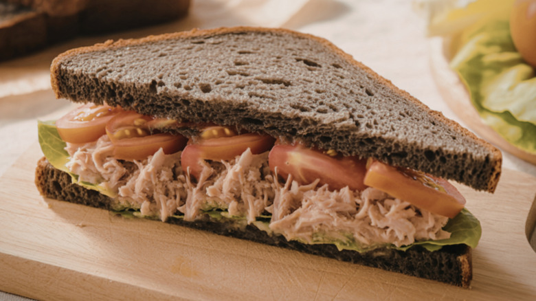 tuna salad with rye bread and tomatoes cut diagonally