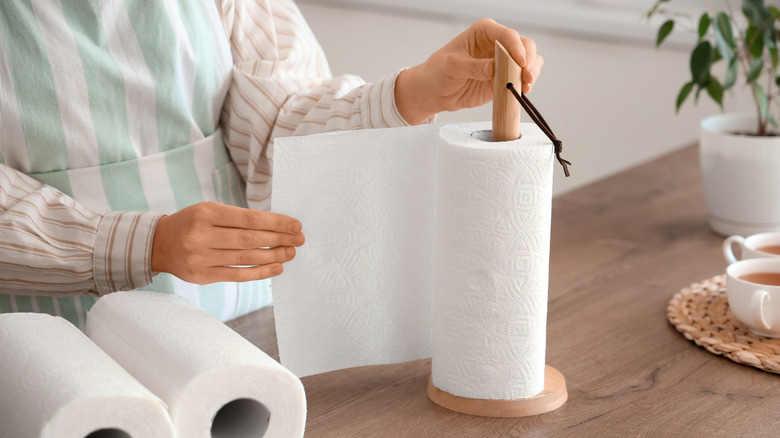 Person Ripping off Paper Towels