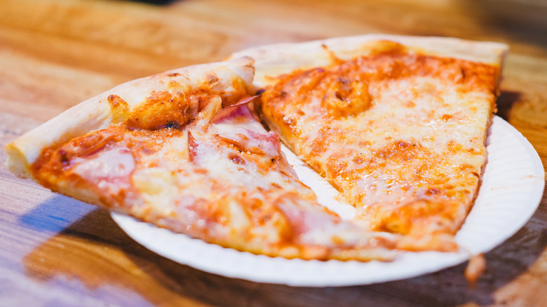 slices of pizza on paper plate