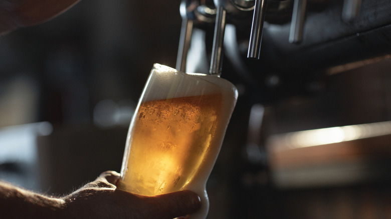 Pouring beer from tap