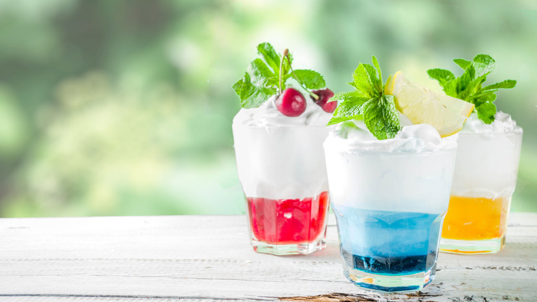 Three different cream-topped Italian sodas