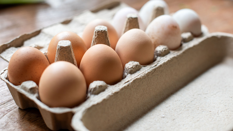 Carton full of brown eggs