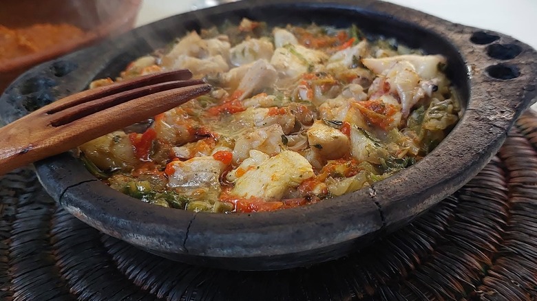 Moroccan fish tagine with a wooden fork