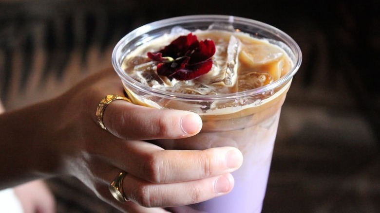 a purple and brown iced ube latte