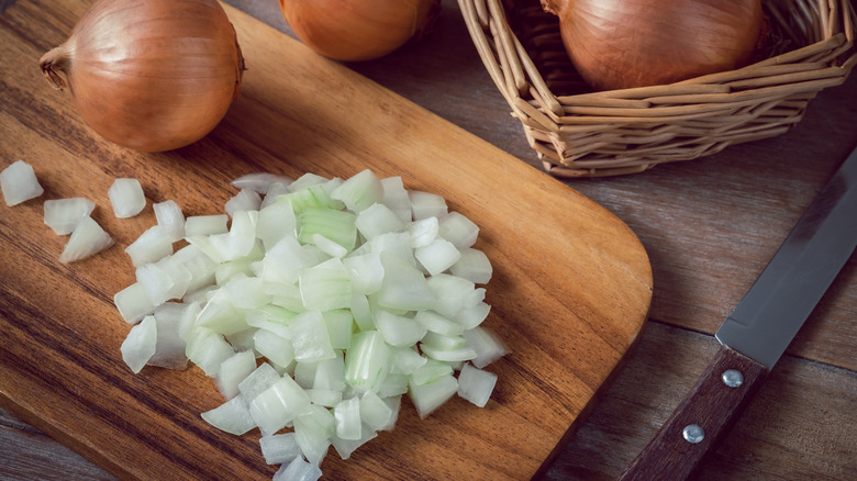 Chopped onions on cutting board